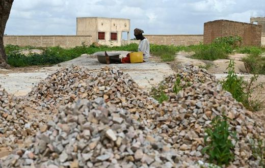 Sixteen people have died in an attack on a mosque in Burkina Faso's volatile north, security sources said; A woman, who is among the 300,000 internally displaced because of jihadist violence in northern and eastern Burkina Faso, is pictured September 1...
