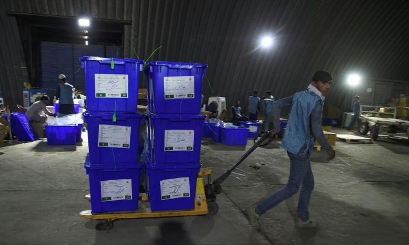 The young employees at Afghanistan's Independent Electoral Commission are rushing through final preparations for the vote, set for September 28