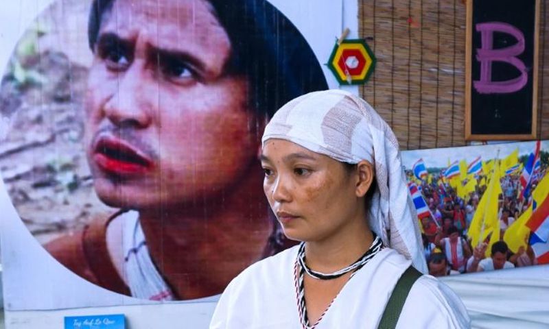 Pinnapha Phrueksapan wiped away tears away at a sombre commemoration ceremony in Bangkok of her husband's life