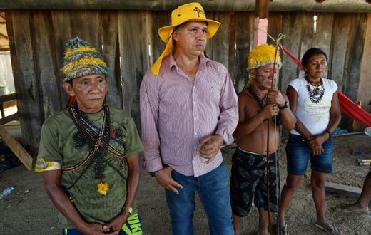 Brazilian illegal gold miner Inacio Vilela (2-L) and Munduruku indigenous people, speak with AFP in Morais Almeida, Itaituba, Para state, Brazil, on September 13, 2019. Members of an indigenous tribe have called for wildcat miners to be allowed to pros...