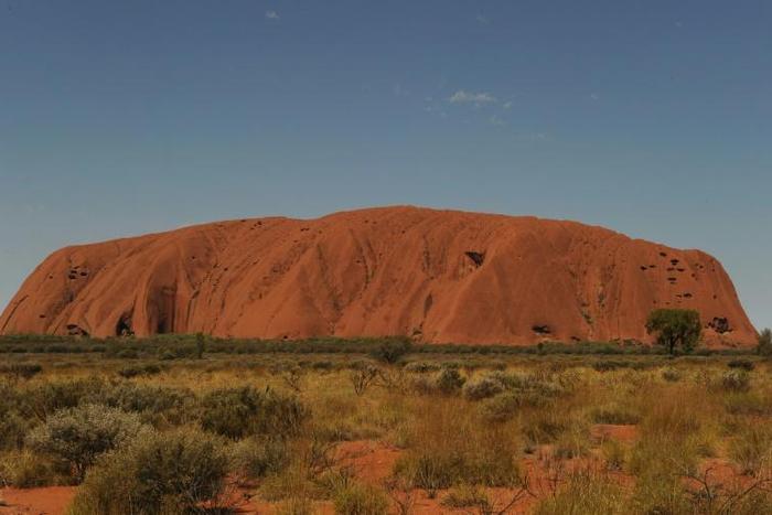 Uluru, formerly known as Ayers Rock, is a a large sandstone rock formation and the world's biggest monolith