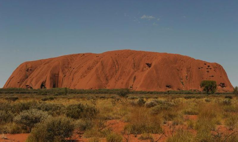 Uluru, formerly known as Ayers Rock, is a a large sandstone rock formation and the world's biggest monolith
