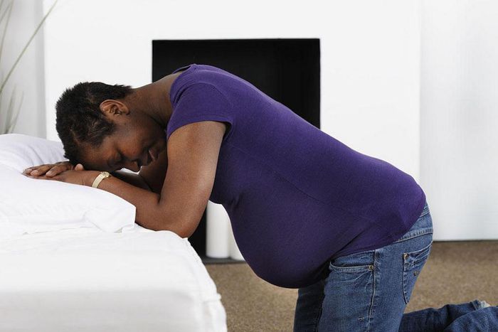 Pregnant woman kneeling(BabyCentre)