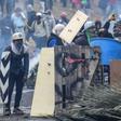Demonstrators in Ecuador clash with riot police during a protest over a fuel price hike ordered by the government to secure an IMF loan