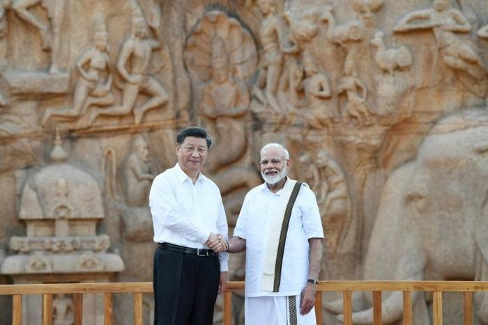 India's Prime Minister Narendra Modi (R) told Chinese President Xi Jinping their summit would launch a 'new era of cooperation' between the Asian giants