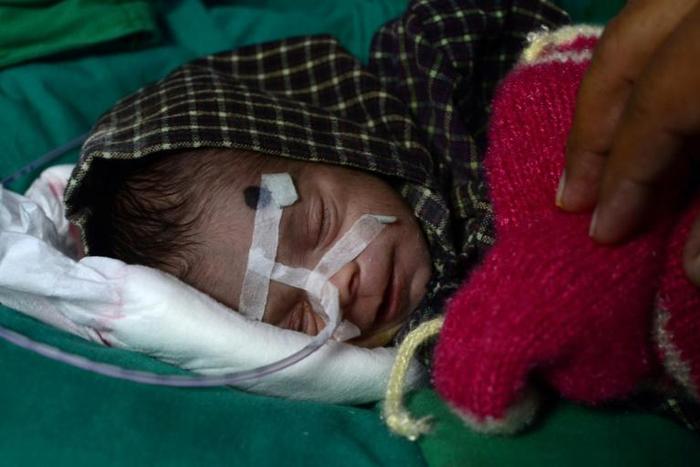 The baby girl, who is in an incubator, is now 'out of danger' and responding to antibiotic treatment, doctors say