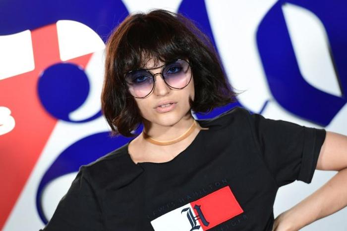 As the fashion world looks to go green, Italian influencer Federica Messaggeri poses during the presentation of the 'Tommy X Lewis' collection, a collaboration between US designer Tommy Hilfiger and British Formula One driver Lewis Hamilton
