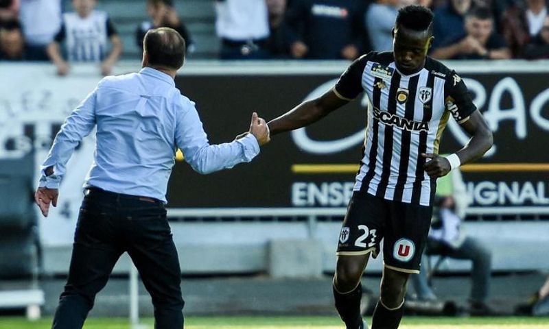 Chadian Casimir Ninga celebrates with coach Stephane Moulin after scoring for Angers against Saint-Etienne