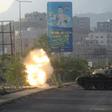 Yemeni fighters loyal to exiled President Abedrabbo Mansour Hadi fire from a tank during clashes with Shiite Huthi rebels in the country's third-city of Taez
