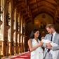 Britain's Prince Harry, Duke of Sussex (R), and his wife Meghan, Duchess of Sussex, pose with their newborn baby son, Archie Harrison Mountbatten-Windsor, in St George's Hall at Windsor Castle