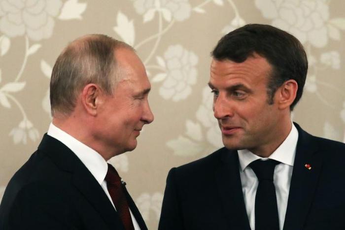 Macron (R) who hosted his Russian counterpart in grand style at the palace of Versailles in 2017, will this time meet Putin at his official holiday residence in Bregancon in southern France