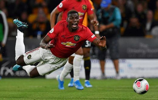 Down and out: Paul Pogba is among a host of Manchester United players missing for the visit of Leicester on Saturday