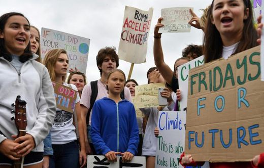 Swedish climate activist Greta Thunberg (C), 16, has inspired a worldwide youth movement demanding governments take action on climate change