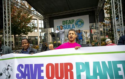 Protestors hold a banner during a demonstration for the climate called 'Act Now or Never' to raise awareness for climate change, organised by 'Rise for Climate Belgium', in on September 22, 2019 in Brussels.