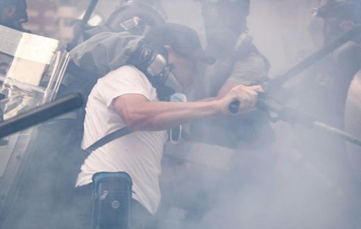 Violence coursed through Hong Kong on National Day, with dozens hurt and more than 150 people arrested