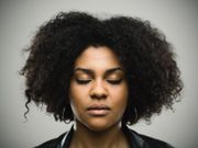 Black woman closing eyes(Black Enterprise)