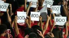 Hong Kong's football body has been fined after fans turned their backs and booed during the Chinese anthem at the start of a World Cup qualifying football match against Iran