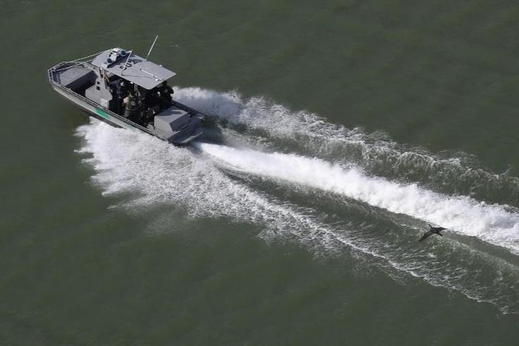 A US Border Patrol boat moves along the Rio Grande river that separates the United States and Mexico