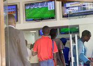 Kenyans place their bets at a betting facility. Association of Gaming Operators explains how 20% withholding tax is calculated on winnings