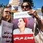 Demonstrators hold up placards of Hajar Raissouni, a Morrocan journalist of the daily newspaper Akhbar El-Youm, who was on Monday convicted of an "illegal abortion" and sentenced to a year in prison