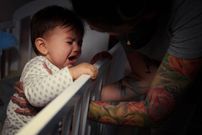 Mummy lulling baby to sleep. Debica, Poland