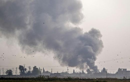 The Turkish military hits Kurdish-controlled towns along the border with air strikes and artillery fire before ground troops cross into Syria