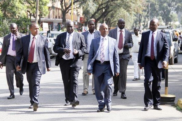 A governor with his security detail