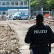 A police officer secures access to the site in Hanover's Zoo district after the bomb's discovery which forced thousands of residents to leave their homes while it was defused