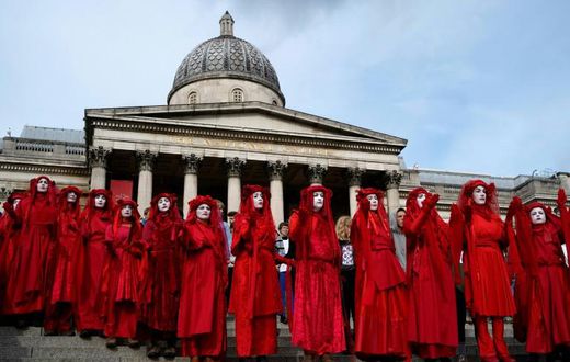 Extinction rebellion activists -- seen on the steps of the National Gallery in London's Trafalgar Square -- said hundreds of their number would occupy London City Airport from Thursday morning until Saturday night