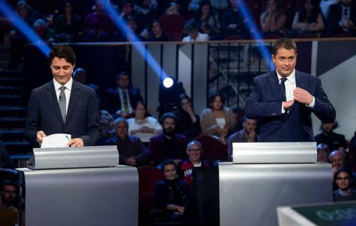 Canada's Prime Minister and Liberal leader Justin Trudeau (L) and Conservative leader Andrew Scheer take part in an election debate on October 10, 2019