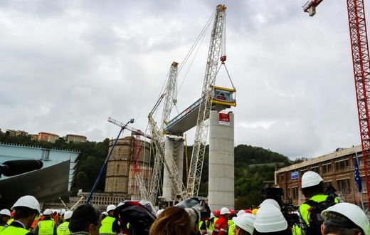 The first deck of Genoa's new bridge was lifted into position just over a year after the collapse that killed 43 people