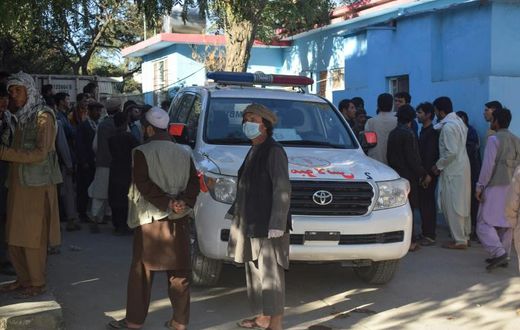 Afghans wait outside a hospital in Kabul for news of friends and family injured in a Taliban attack