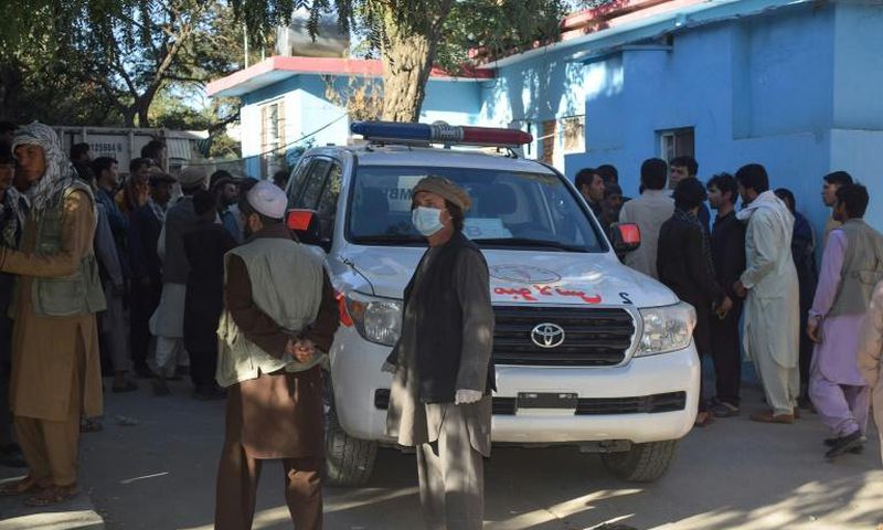 Afghans wait outside a hospital in Kabul for news of friends and family injured in a Taliban attack