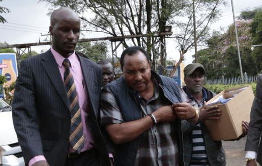 File image of Ferdinand Waititu with detectves  during his recent arrest over corruption