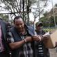 File image of Ferdinand Waititu with detectves  during his recent arrest over corruption