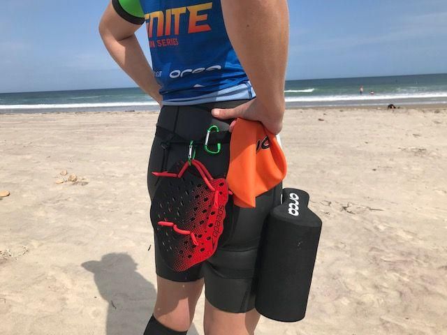 Anything you want during the race you have to carry, including paddles, buoy, cap, gels, and a required whistle, First Aid kit, GPS locator and timing chip. This was our setup, which Im sure will get refined.