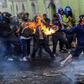 Demonstrators clash with riot police in Quito. The protestors are demanding the president reinstate fuel subsidies which were cut last week