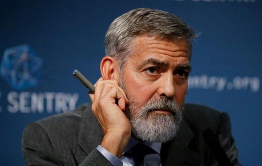 US actor George Clooney takes part in a press conference in central London to present a report on corruption in South Sudan