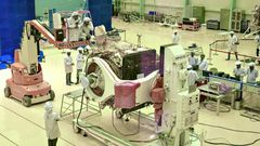 Scientists work on the orbiter vehicle of Chandrayaan-2, India's first moon lander and rover mission