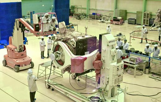 Scientists work on the orbiter vehicle of Chandrayaan-2, India's first moon lander and rover mission
