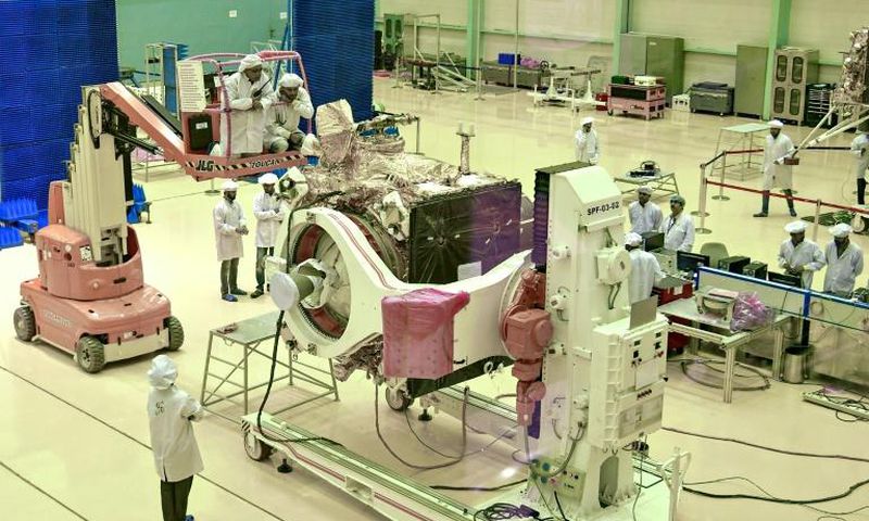 Scientists work on the orbiter vehicle of Chandrayaan-2, India's first moon lander and rover mission