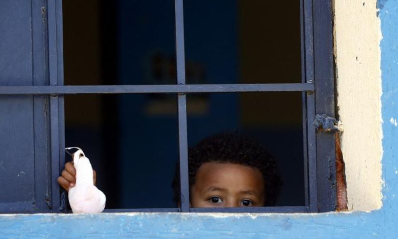 The UNHCR airlifted 149 African migrants, including 65 minors and 13 infants (similar to the child pictured in a detention centre in April 2019) from Libya to Rome for safety