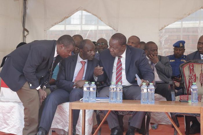 Interior CS Fred Matiang'i, Immigration PS Gordon Kihalangwa in Nakuru. 5 Chinese nationals working at Gikomba market to be deported