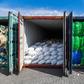 A Malaysian official inspects containers filled with plastic waste in Port Klang, west of Kuala Lumpur, in May 2019
