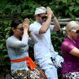 Czech nationals Sabina Dolezalova (2nd R) and her boyfriend Zdenek Slouka (2nd L) took part in a purification ritual in Bali after a disrespectful online video they posted went viral