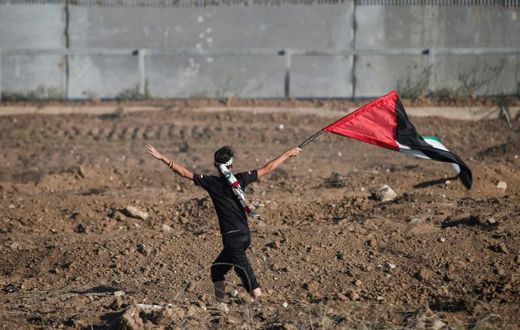The Palestinian Authority will receive a transfer of 1.5 billion shekels ($430 million) from Israel, officials from the two governments said Friday, in a step towards resolving a months-long standoff; a young protester waves a Palestinian flag on Octob...