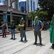 Activists block a street in Guatemala City to protest against a migration agreement signed with the US
