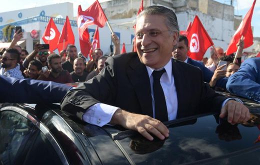 Tunisian presidential candidate Nabil Karoui meets his supporters in the northern city of Bizerte on October 11, 2019 two days before a runoff vote pitting him against independent conservative academic Kais Saied