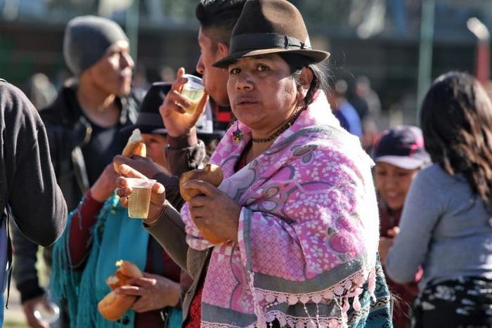 A sharp rise in fuel prices has sent thousands of indigenous, like this woman, into the streets of Ecuador's capitol