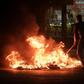 Sudanese protesters burn tyres on June 20, 2019, during a government crackdown that has resulted in 128 deaths